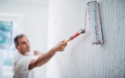 man-painting-walls-in-home